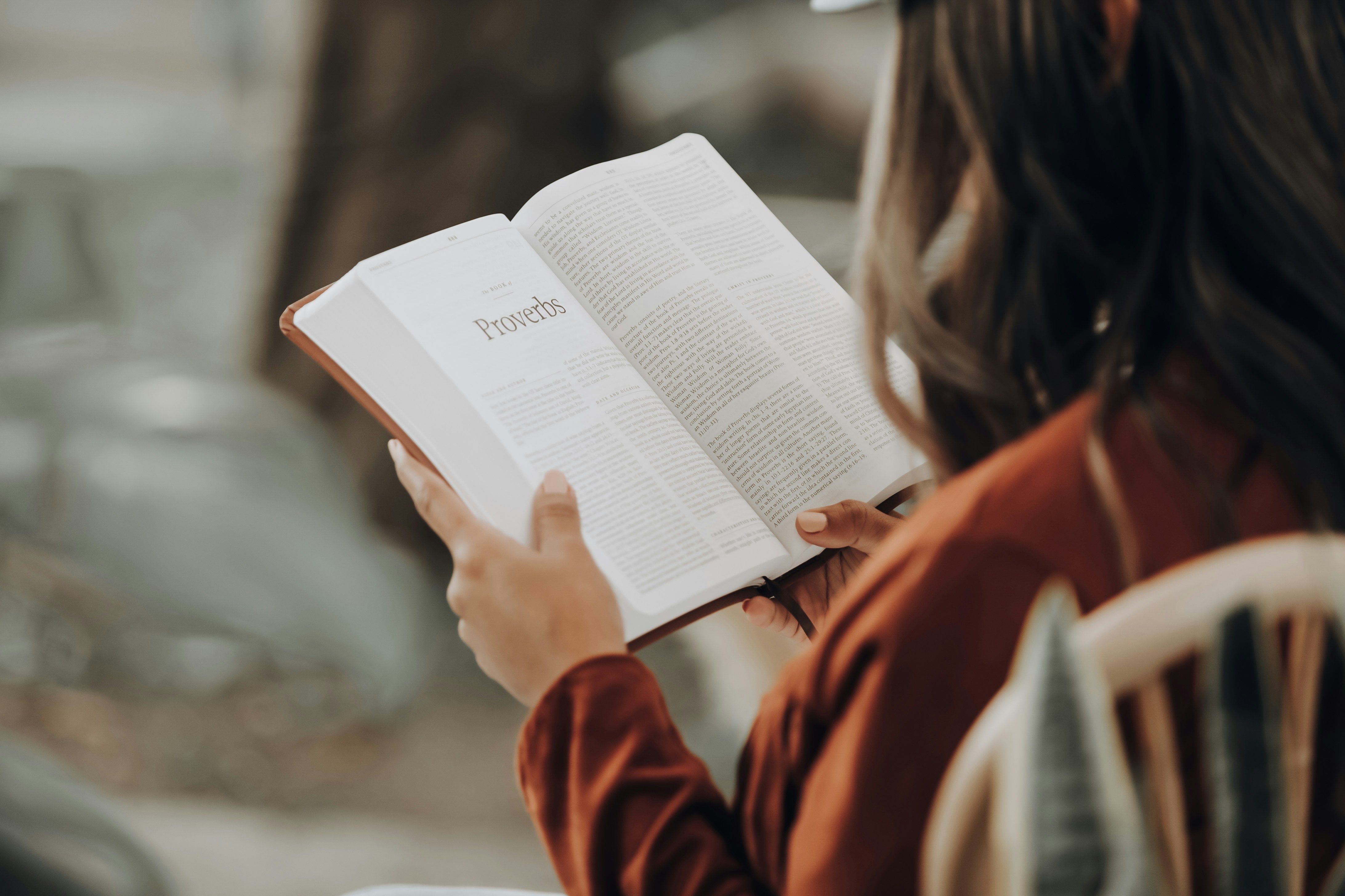 A woman reading scripture — warm, peaceful setting